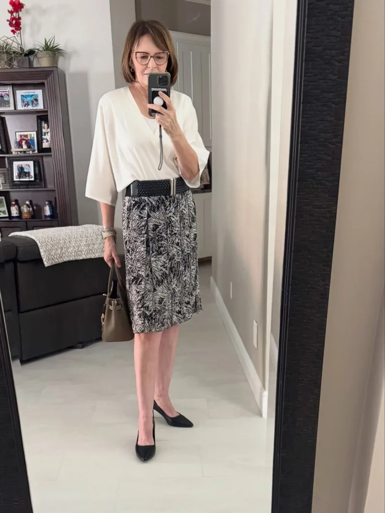 Belted Cream Blouse With a Black and White Print Skirt