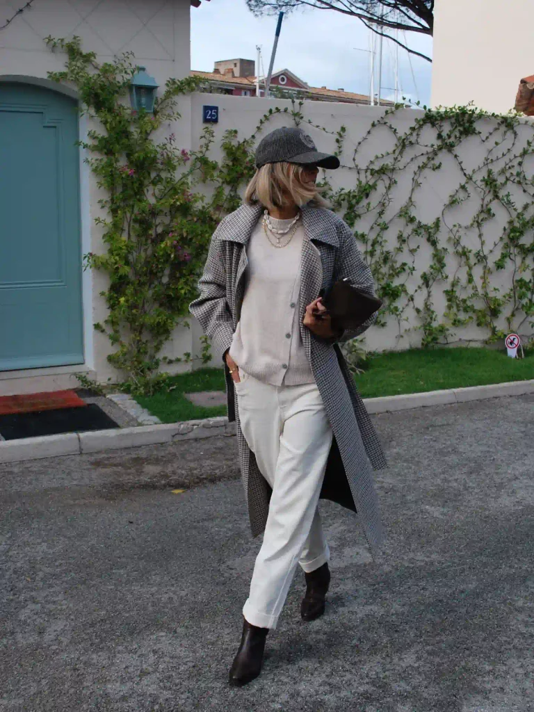Cream-on-Cream Layers Under a Checked Long Coat.