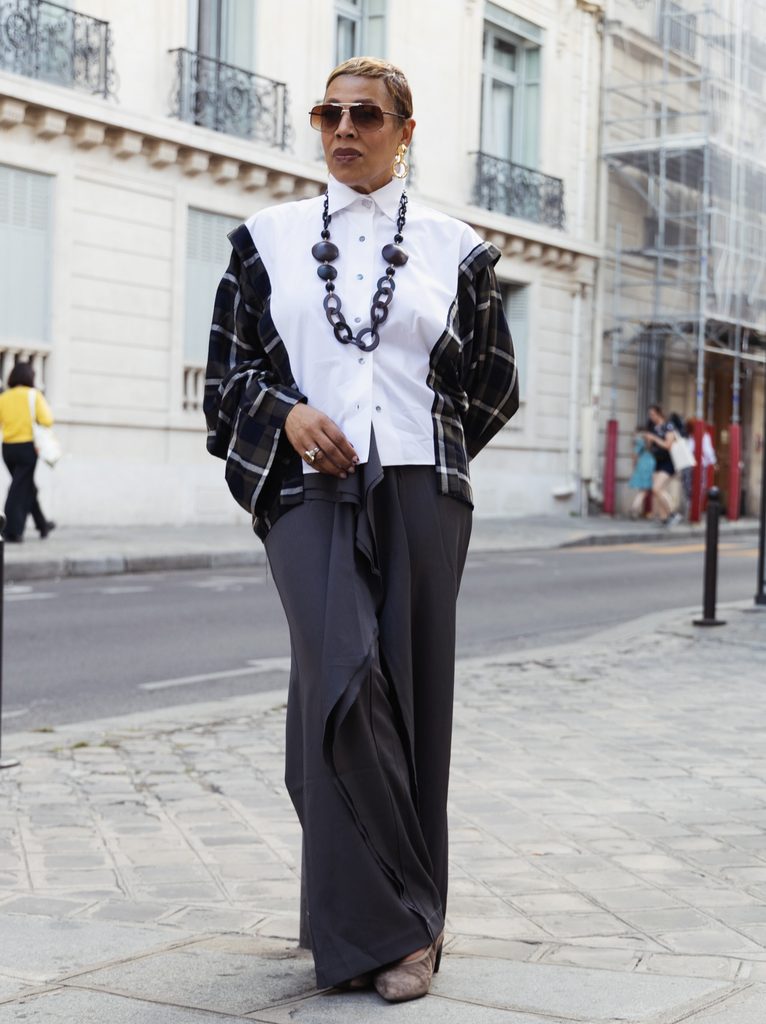 Architectural White Shirt with Plaid Sleeves and Draped Wide-Leg Trousers.